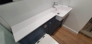 white sink and blue furniture